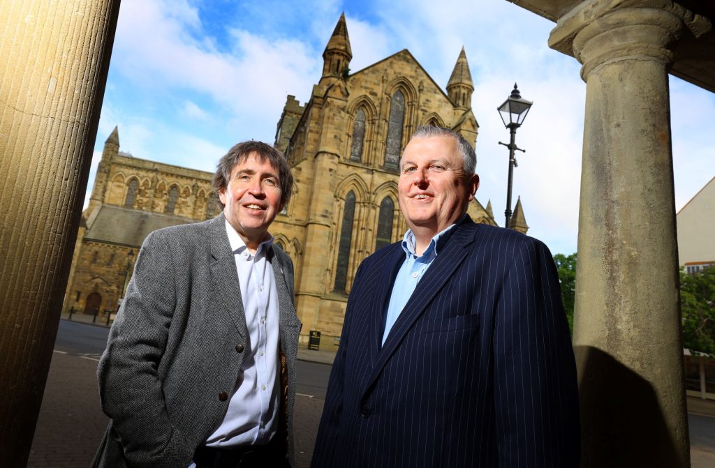 Peter McCowie (left) and Stephen Slater (right) from RMT Accountants standing in front of Hexham Abbey
