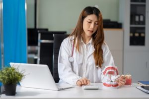 dentist doing accounts